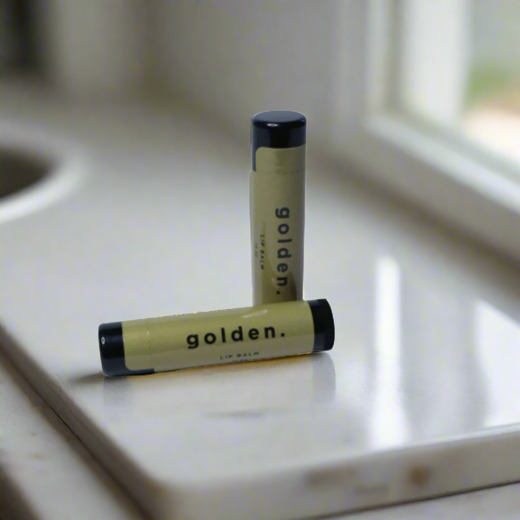 Closed tube of fragrance-free lip balm for men on a countertop