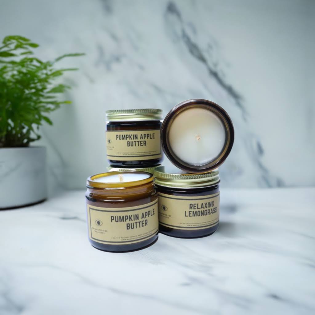 Stack of Pumkin apple butter and relaxing lemongrass mini-Aromatherapy candles