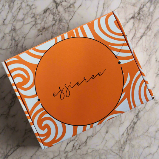 Essieree subscription box with black letters and orange design
